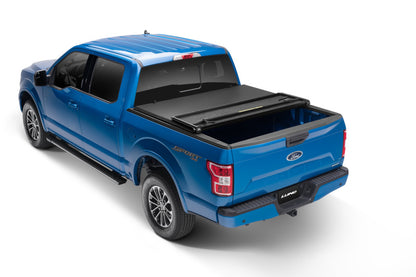 Lund 05-10 Dodge Dakota Fleetside (6.5ft. Bed) Hard Fold Tonneau Cover - Black